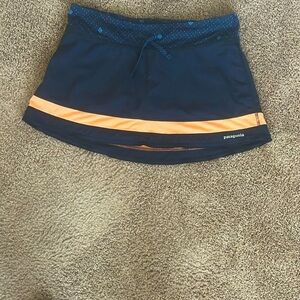 Patagonia- Size Medium, swim skirt, attached shorts, Navy/Peach.